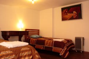 Postel nebo postele na pokoji v ubytování Emperatriz Guest House