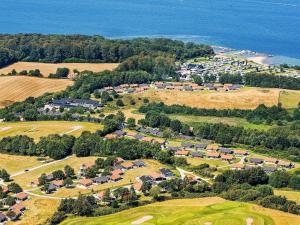 an aerial view of a town with houses and the ocean at Løjt Holiday Center in Aabenraa
