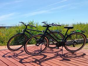 two bikes parked next to each other on a table at Summer house for 4 people, close to the sea in Łazy