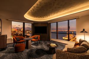 a living room with a view of a city at The Gate Hotel Yokohama by Hulic in Yokohama