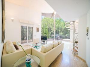 a living room with a couch and a table at Villa in Alcúdia near Sandy Beach in Alcudia