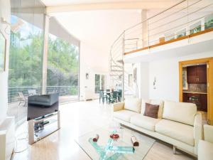 a living room with a couch and a table at Villa in Alcúdia near Sandy Beach in Alcudia +16 photos