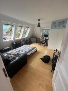 a bedroom with a bed in a room with windows at Charmant T3 entre plage des Catalans et Vieux Port in Marseille