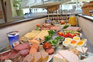 a buffet line with many different types of food at Haus-Kleist-Zimmer-5 in Prerow