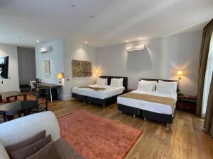 Ένα ή περισσότερα κρεβάτια σε δωμάτιο στο Misafir Suites 8 Istanbul +84 φωτογραφίες