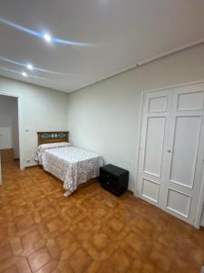 Ένα ή περισσότερα κρεβάτια σε δωμάτιο στο Piso plaza +1 φωτογραφίες