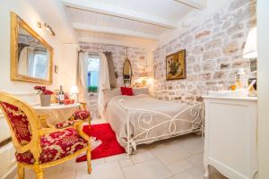 Ein Bett oder Betten in einem Zimmer der Unterkunft Villa Segalla