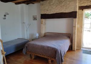 Ένα ή περισσότερα κρεβάτια σε δωμάτιο στο Maison de caractère à Montignac Lascaux +29 φωτογραφίες