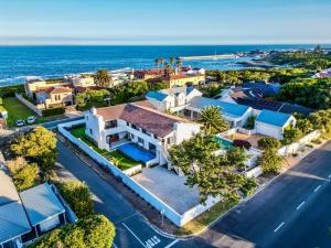 an aerial view of a house and the ocean at The Cliff Villa Boutique Guesthouse in Hermanus