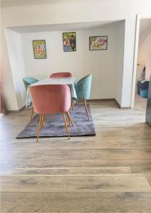 a dining room with a table and chairs at s'Felix - Übernachten bei Freunden in Schönwald +6 photos