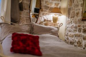 Ein Bett oder Betten in einem Zimmer der Unterkunft Villa Segalla