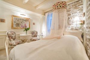 Ein Bett oder Betten in einem Zimmer der Unterkunft Villa Segalla