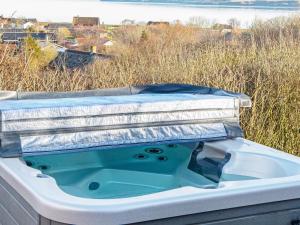 a bath tub with a lid on top of it at 6 person holiday home in Lemvig in Lemvig