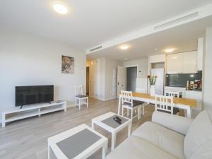 a living room with a couch and a table at Cubo's Marques Apartment with Free Parking in Almayate Alto