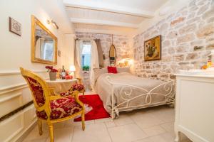 Ein Bett oder Betten in einem Zimmer der Unterkunft Villa Segalla