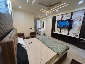 TV a/nebo společenská místnost v ubytování The Ganj Studio + 11 fotografií