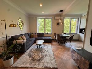 a living room with a couch and a table at Monaco in Šiauliai