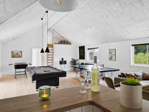 a living room with a pool table and ping pong ball at 5 star holiday home in Frederiksværk in Frederiksværk +52 photos