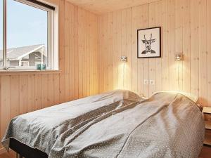 a bedroom with a bed and a window at 5 star holiday home in Kappeln in Kappeln