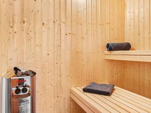 a inside of a sauna with a heater and a shelf at 5 star holiday home in Kappeln in Kappeln +18 photos