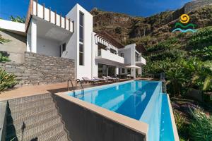 an image of a villa with a swimming pool at OurMadeira - The Designhouse, contemporary in Arco da Calheta