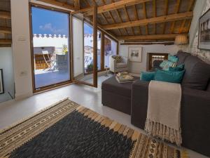 a living room with a couch and a large window at Holiday Home in Vodnjan near the Sea in Vodnjan
