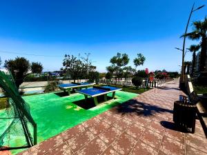 two ping pong tables in a pool of green water at Ocean side - Prestige & Douceur familliale 2 chambres in Casablanca