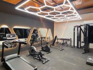 a gym with several treadmills and elliptical machines at Borj Dhiafa in Sfax
