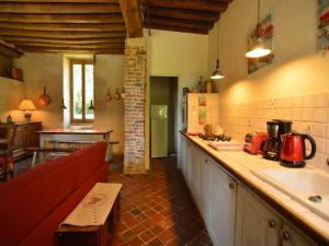 a kitchen with a counter and a sink in it at Mansion in Champvert with Pond View Terrace in Champvert