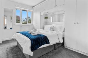 a bedroom with a large bed with a teddy bear on it at 6 Bedrooms, Driveway Parking, Pool Table, Netflix, Huge Long Term Savings in Great Sankey