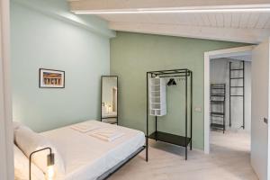 a bedroom with a bed and a mirror at Residenza Borgo Antico Lucia in Ascea +19 photos