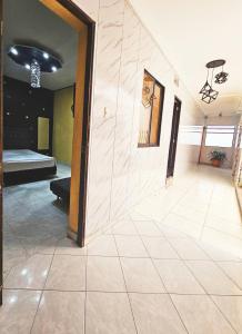 a large room with a large tile floor at Apartahotel Casa Blanca in Medellín