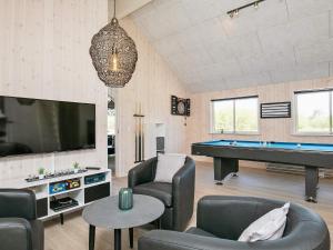 a living room with a pool table and a tv at Luxury Retreat in Marielyst - By Traum Ferienwohnungen in Marielyst