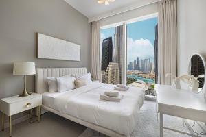 Katil atau katil-katil dalam bilik di Lux 3BR With Spectacular Downtown Views