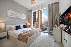 Katil atau katil-katil dalam bilik di Lux 3BR With Spectacular Downtown Views