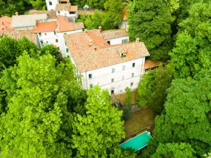 an aerial view of a house in a forest at Spacious Villa Retreat in San Marcello Pistoiese