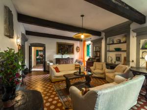 a large living room with couches and a table at Spacious Villa Retreat in San Marcello Pistoiese
