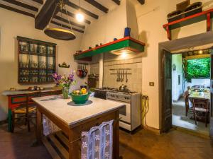 a kitchen with an island in the middle of a room at Spacious Villa Retreat in San Marcello Pistoiese