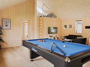 a living room with a pool table in it at 16 person holiday home in Hasselberg in Kappeln +20 photos