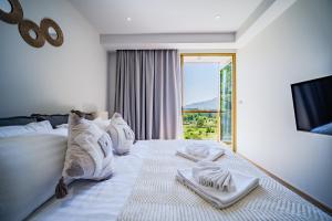 Ένα ή περισσότερα κρεβάτια σε δωμάτιο στο Beachside 1 BR apartment by NLA