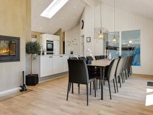 a dining room and kitchen with a table and chairs at Luxury Retreat in Blavand - By Traum Ferienwohnungen in Blåvand