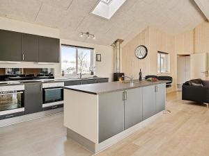 a large kitchen with a large island in the middle at 5 star holiday home in Kappeln in Kappeln