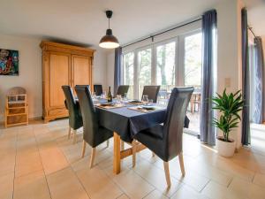 a dining room with a table and chairs at Peaceful Durbuy Home & Garden in Durbuy
