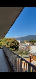 a balcony with a view of a city at Loft charmoso bem no centro in São Sebastião