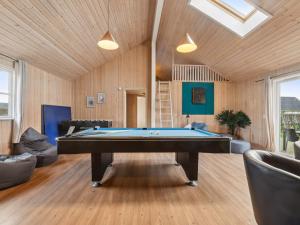a living room with a pool table in it at Luxury Pool Villa in Bagenkop - By Traum Ferienwohnungen in Bagenkop