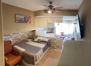 a bedroom with a bed and a ceiling fan at Promar Playa 255 in La Pineda