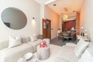a living room with a couch and a table at Holiday Home in Antwerp in Antwerp