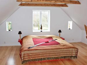 a bedroom with a large bed in a attic at 4 star holiday home in Söderåkra in Söderåkra
