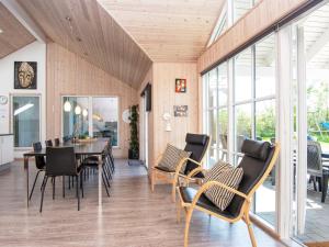 a dining room with a table and chairs at 5 star holiday home in Odder in Odder