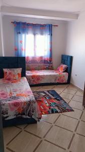 Postel nebo postele na pokoji v ubytování location appartement F4